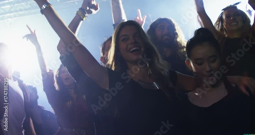 Group of people dancing at a concert  photo