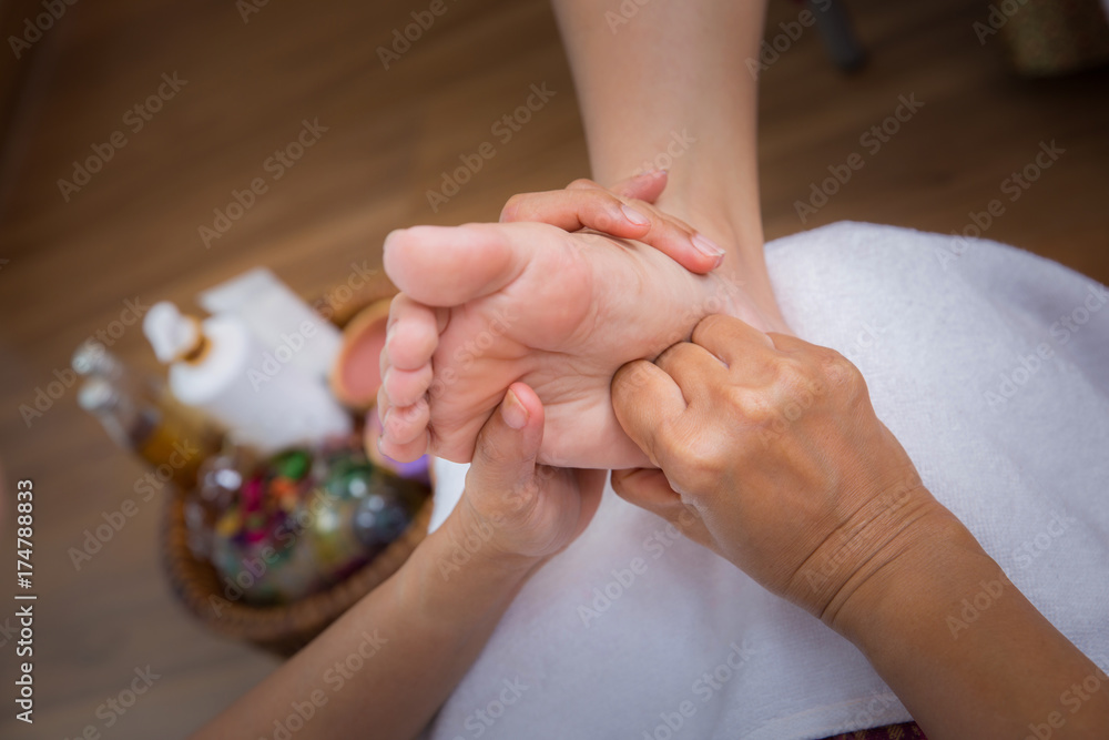 Naklejka premium Foot massage in spa salon