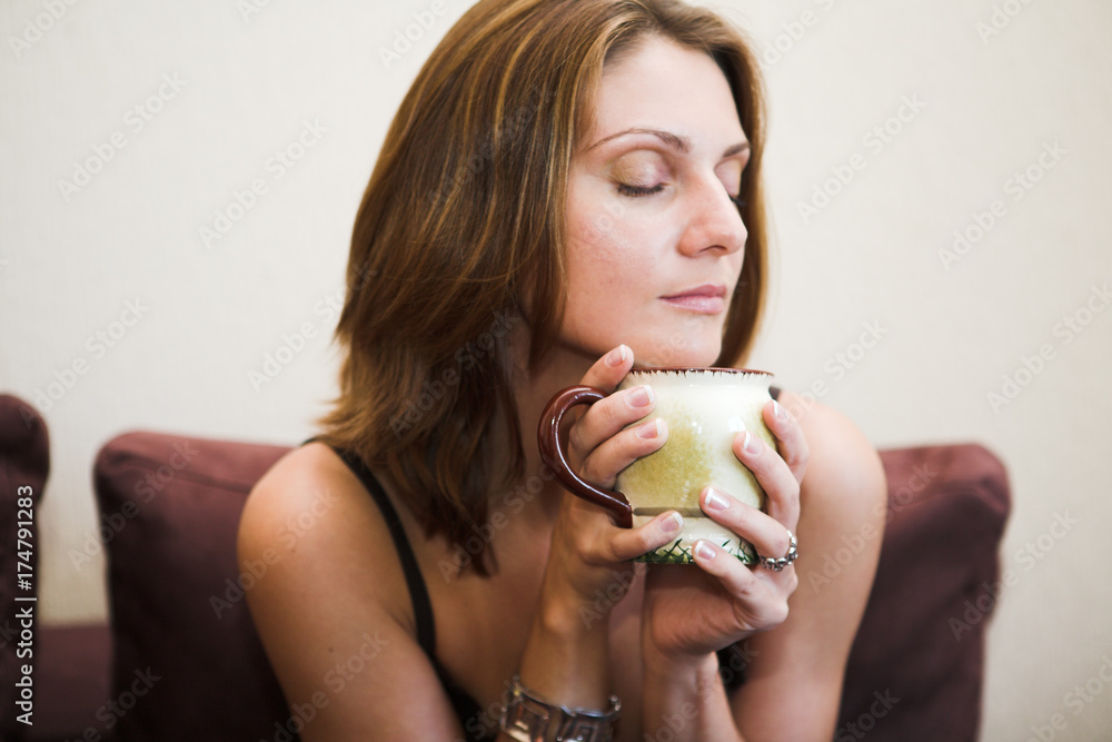 Portrait of young beautiful woman with tea Portrait of young beautiful woman with tea