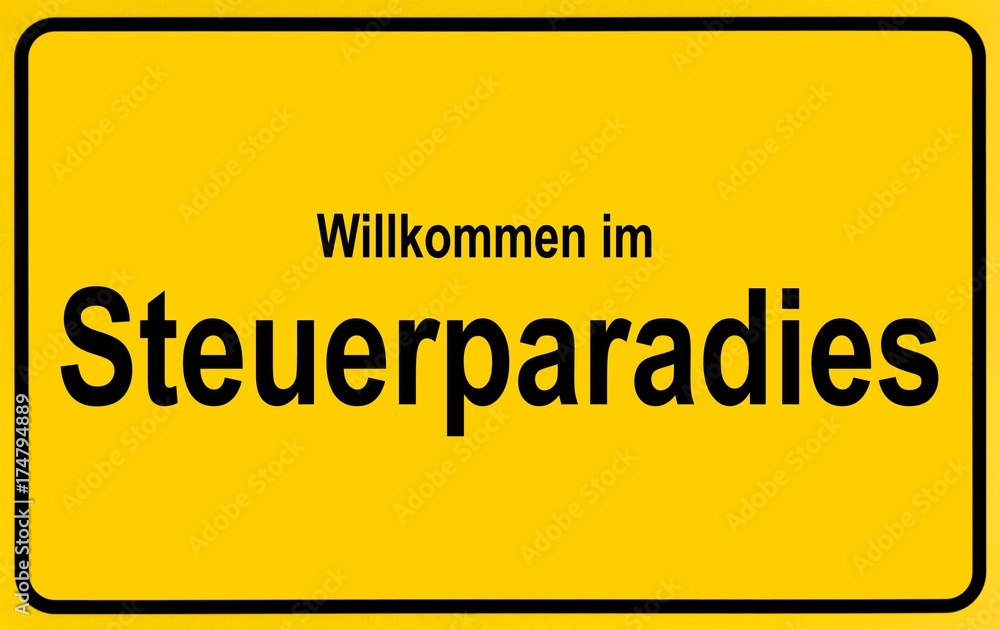 Town sign with the name Steuerparadies, symbolic image for tax haven