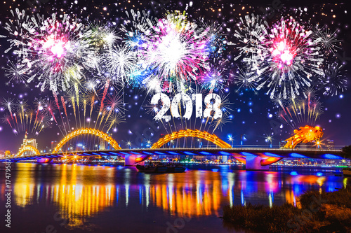 Cheerful fireworks display in city night and bridge