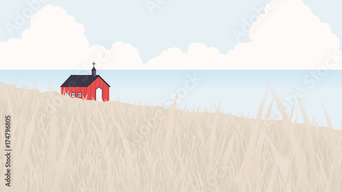 Red church located on seashore and small hill