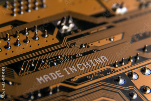 Made in China. Macro of a white inscription on an electrical board.