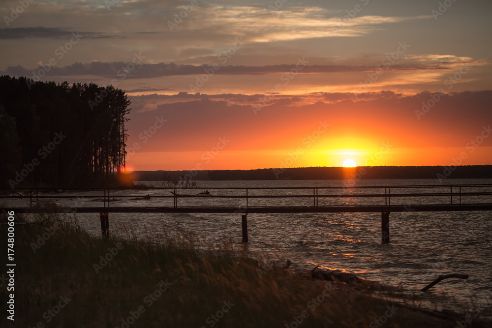 Fototapeta premium Wooden pier at sunset