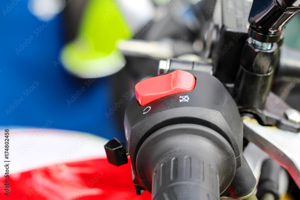 Fototapeta premium Hand pressing the start button on motorcycle