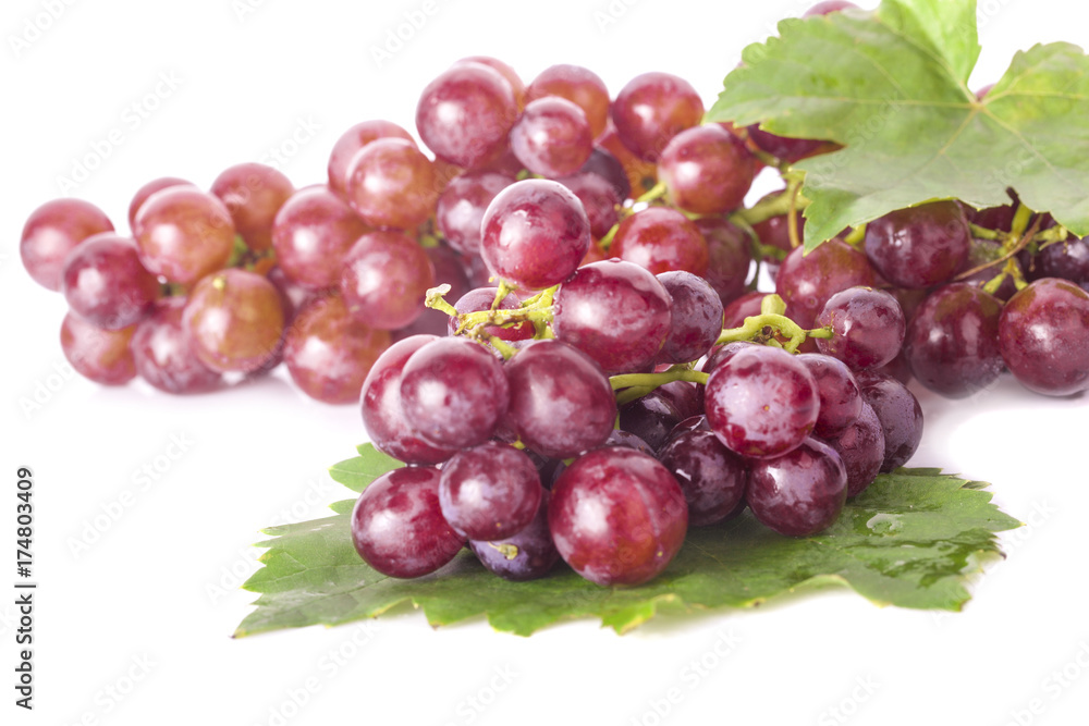 Red grape with leaf isolated on white background Red grape with leaf isolated on white background