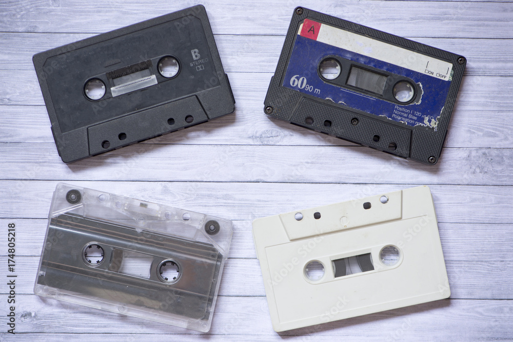 Old cassette tapes with a wooden background Old cassette tapes with a wooden background