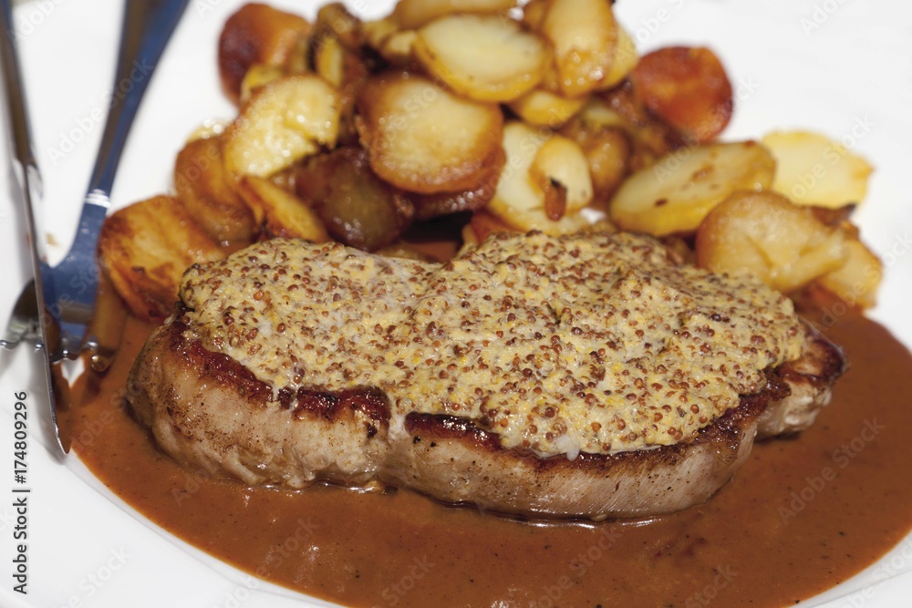Roast pork with mustard crust and baked potatoes Roast pork with mustard crust and baked potatoes
