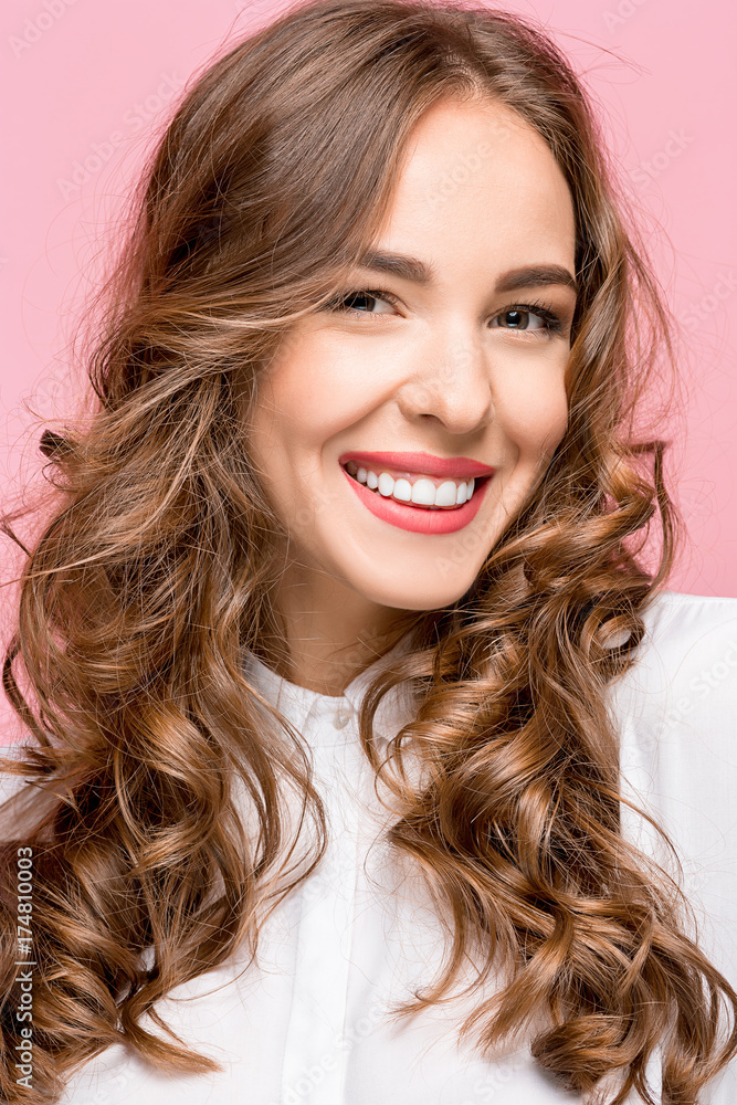 The young woman's portrait with happy emotions The young woman's portrait with happy emotions