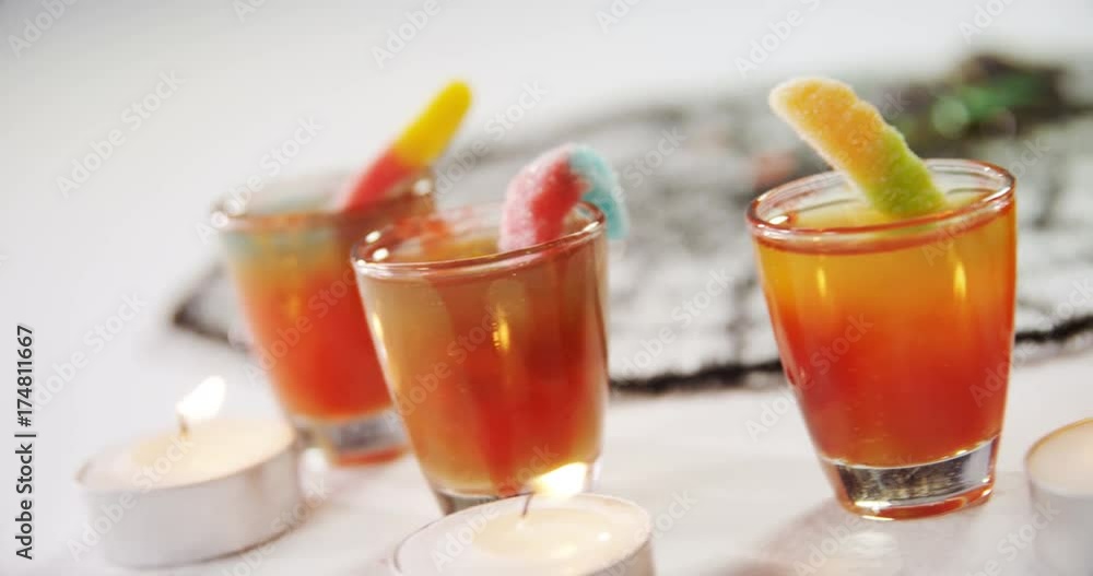 Tealight candles and drinks on white background Tealight candles and drinks on white background