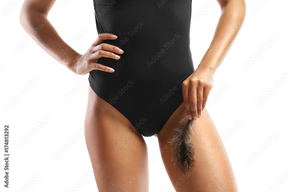 Fototapeta premium Beautiful young woman in swimming suit on white background