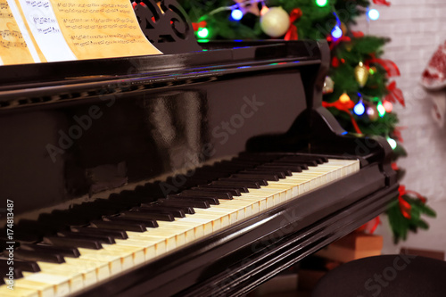 Beautiful piano in room. Christmas music concept