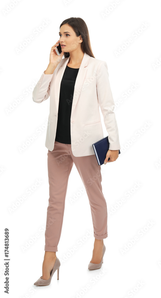 Beautiful young woman speaking by mobile phone on white background Beautiful young woman speaking by mobile phone on white background