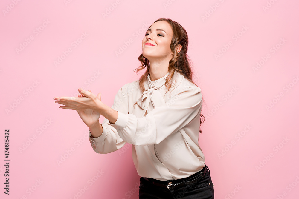 The young woman's portrait with happy emotions The young woman's portrait with happy emotions
