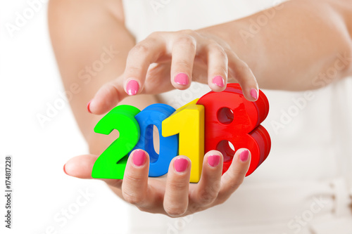 Two Woman Hands Protecting 2018 New Year Sign.