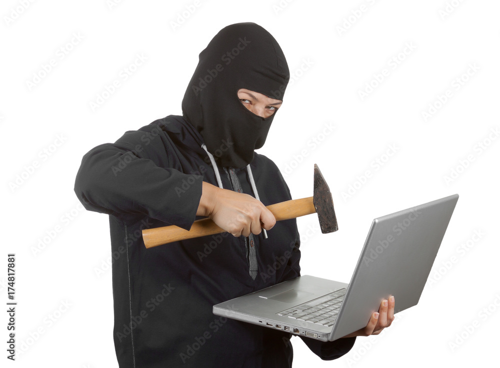 Criminal Woman Hacker Wearing Hood On in Black Clothes and Balaclava Destroy Laptop with Hammer Criminal Woman Hacker Wearing Hood On in Black Clothes and Balaclava Destroy Laptop with Hammer