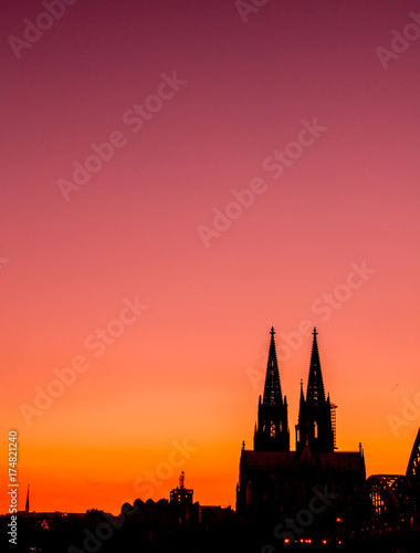 Evening skyline silhouette of Cologne, Germany with copy scape
