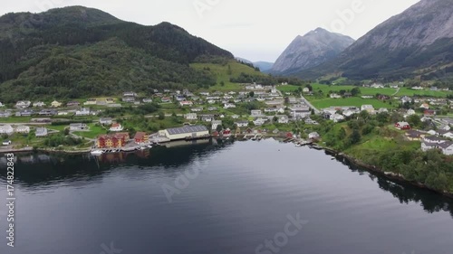 Wallpaper Mural View from above beautiful small fishing town, village, settlement in Norway, Europe. Amazing houses near the coastline, green thick trees, clear sea, river, lake, in the background high mountains Torontodigital.ca