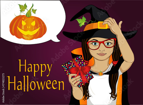 Halloween. A little girl in a hat and a witch costume pensively 