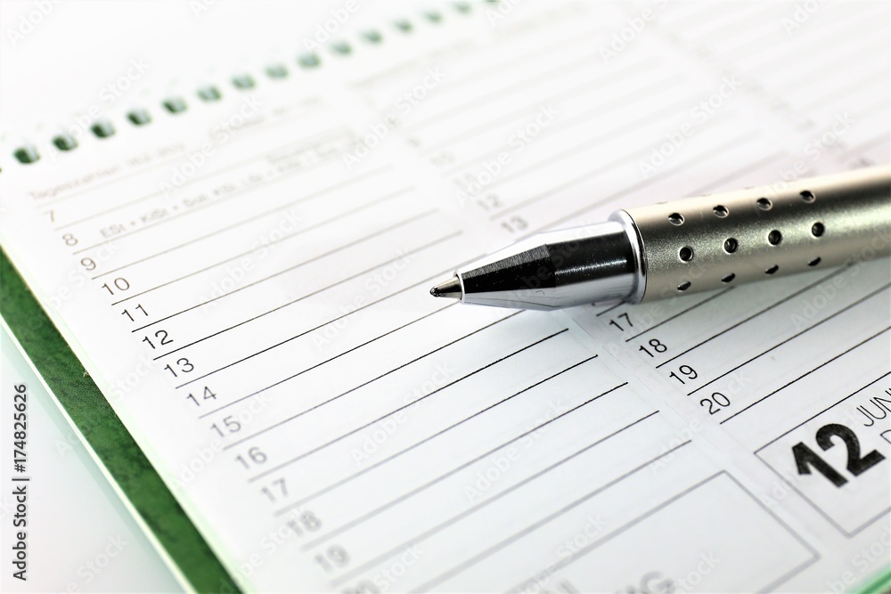 An Image of a calendar and a pen - business An Image of a calendar and a pen - business