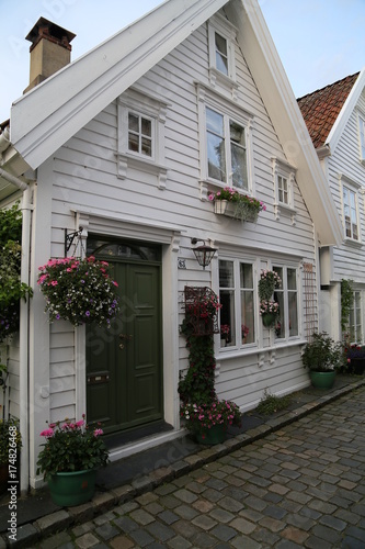 Street with white wooden houses in old centre of Stavanger © Claudio