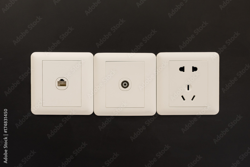 white electric plugs or outlet on wall, with tv and tel white electric plugs or outlet on wall, with tv and tel