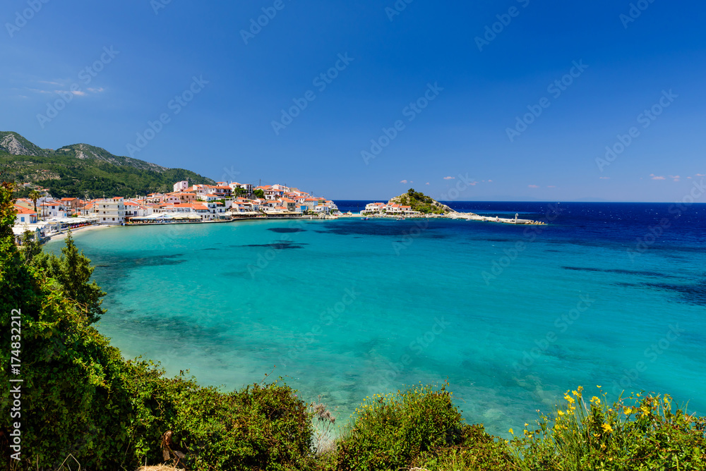 Picturesque Bay with blue water in Kokkari village, Samos island, Greece