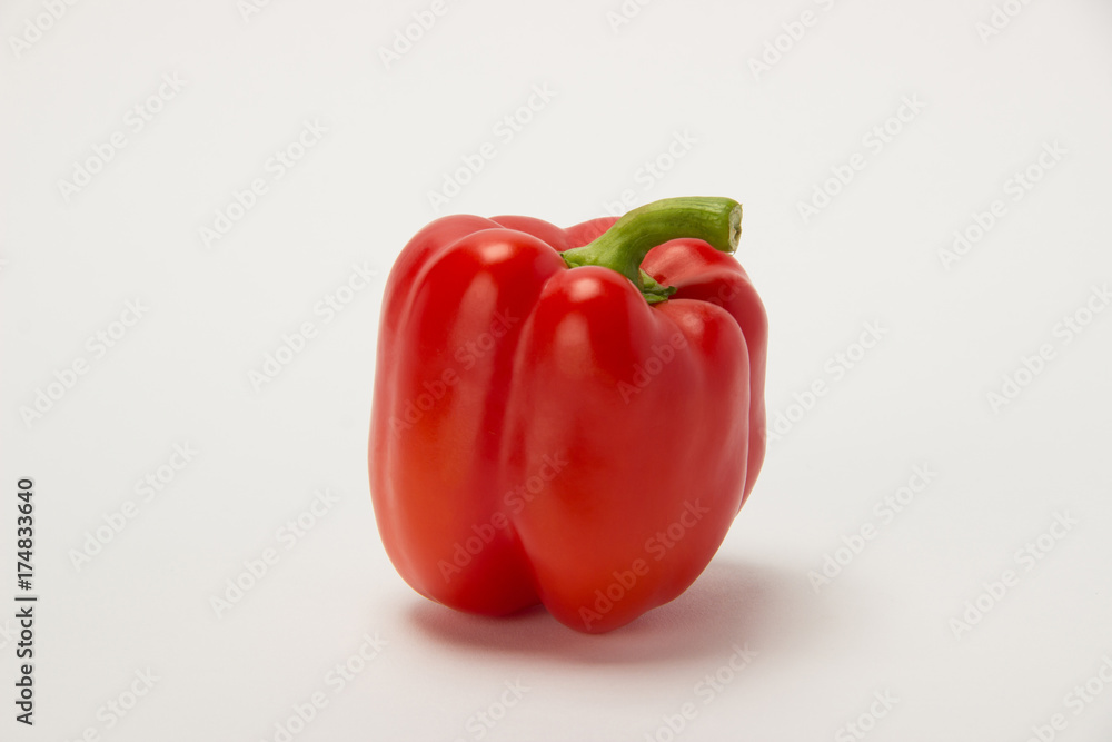 Beautiful big red pepper on a white background Beautiful big red pepper on a white background