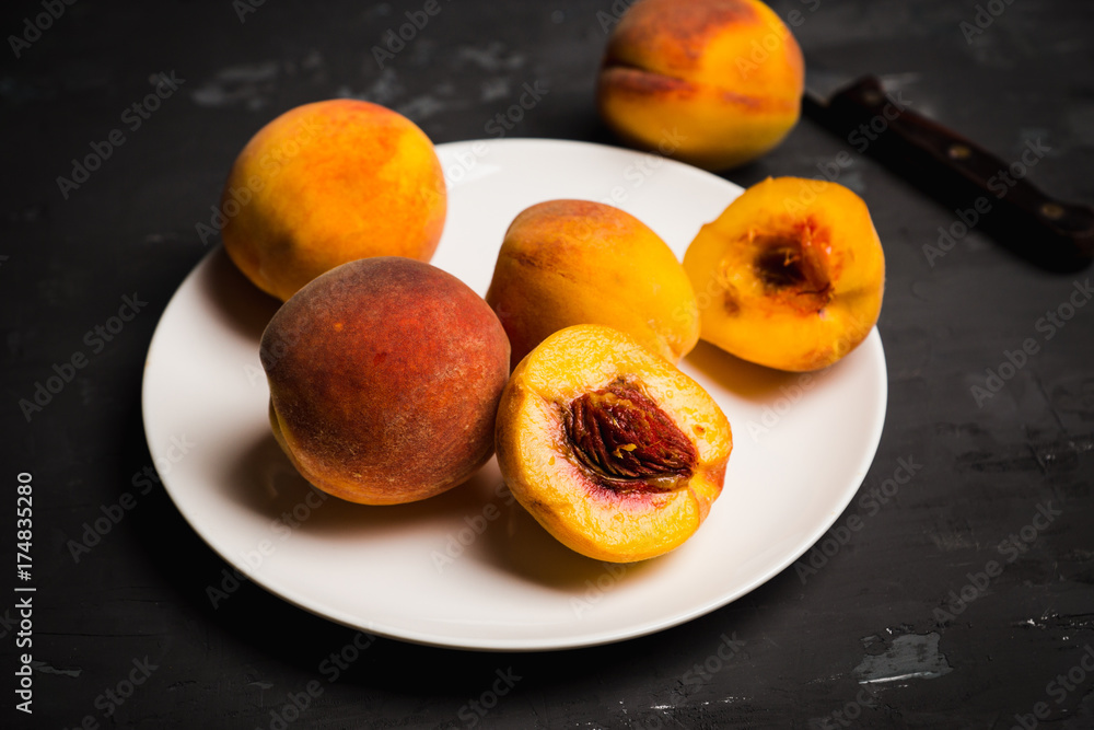 Fresh ripe peaches on the rustic background. Selective focus. Fresh ripe peaches on the rustic background. Selective focus.