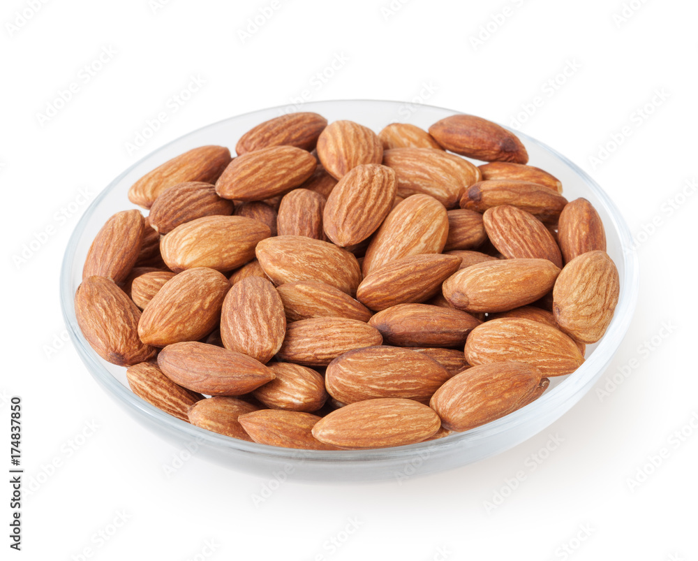 Almonds in glass plate isolated on white background Almonds in glass plate isolated on white background