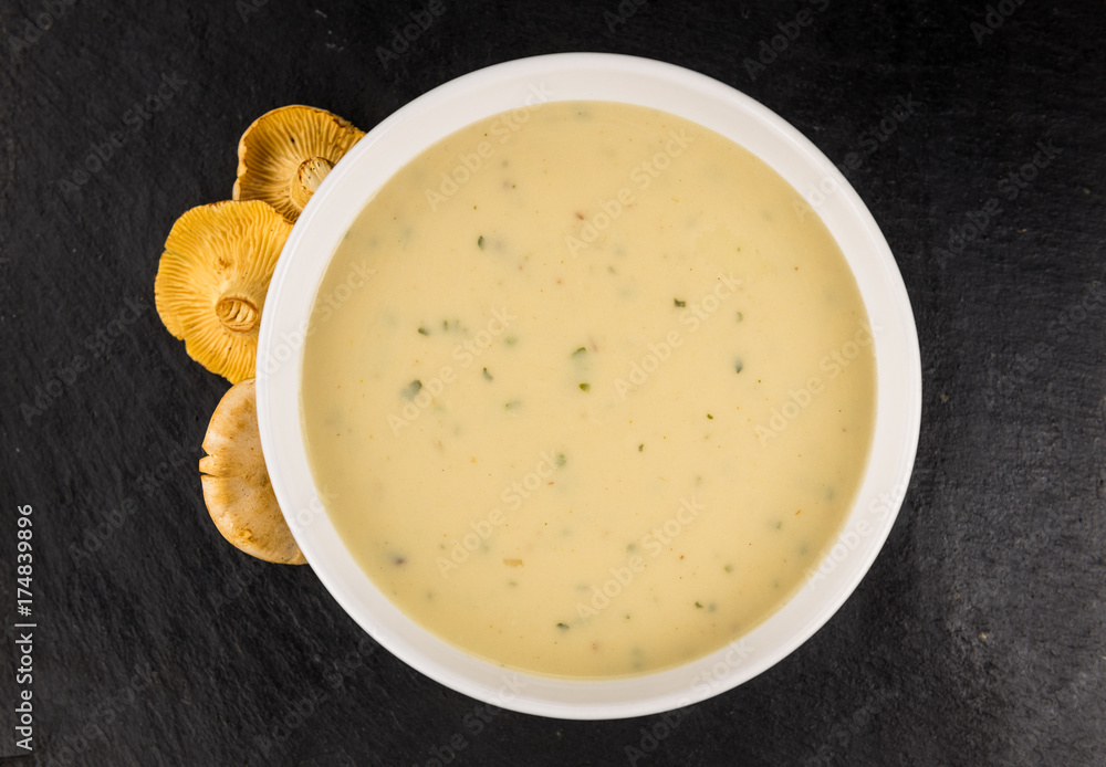 Rustic slate slab with Chanterelle Soup, selective focus