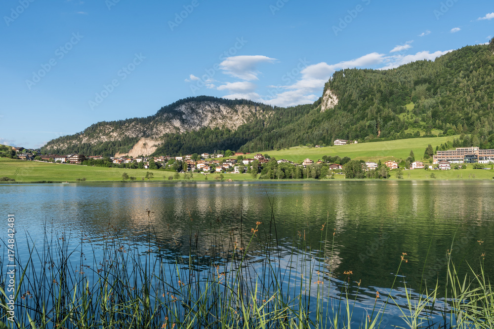 The mountain lake Thiersee in Tyrol, Austria The mountain lake Thiersee in Tyrol, Austria