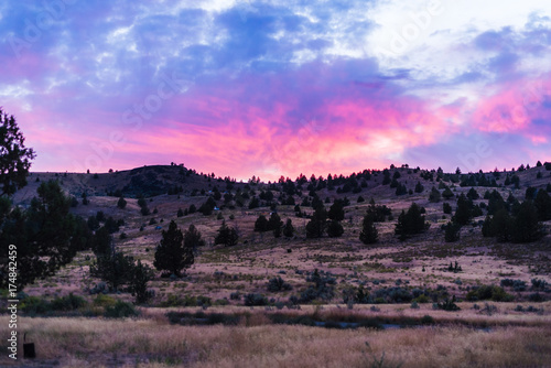 Beautiful pink sunset over the desert hills of Oregon