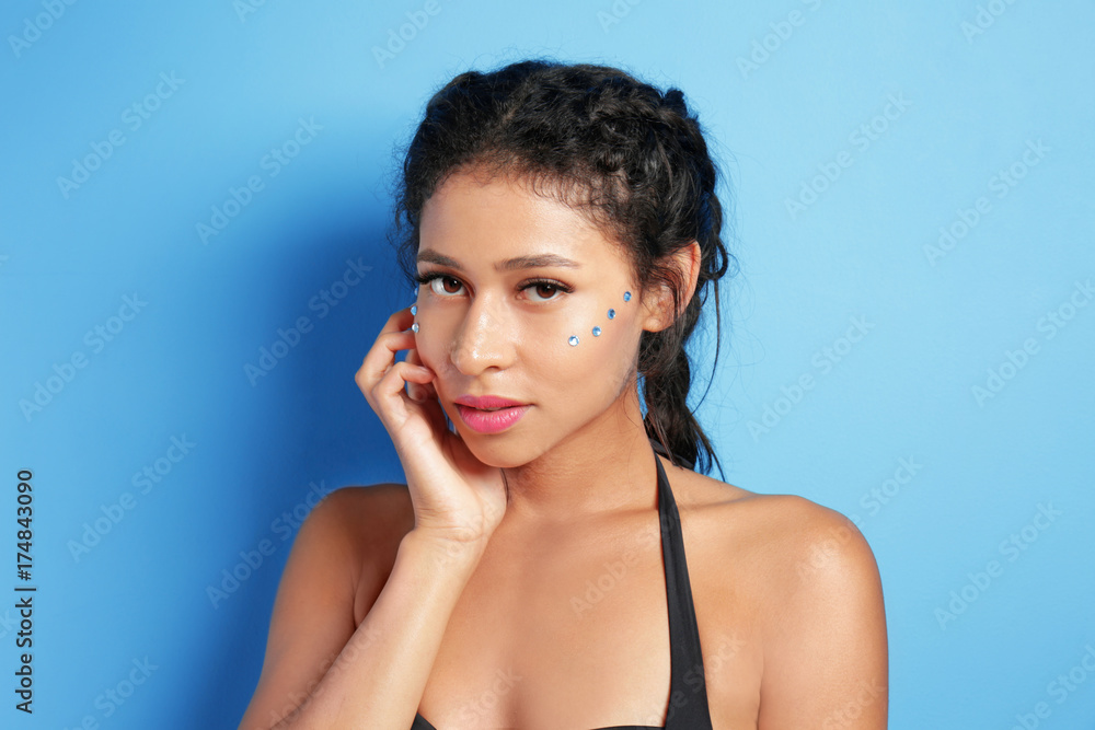 Beautiful young woman in swimming suit on color background Beautiful young woman in swimming suit on color background
