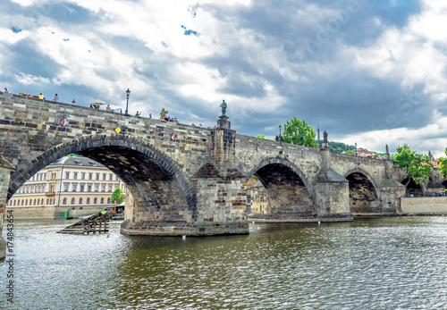 Landscape of the romantic city of Prague under a blue sky. Panoramic view of Charles bridge and old town on a summer day in the capital Czech Republic. Cruise on the Moldovan river. 