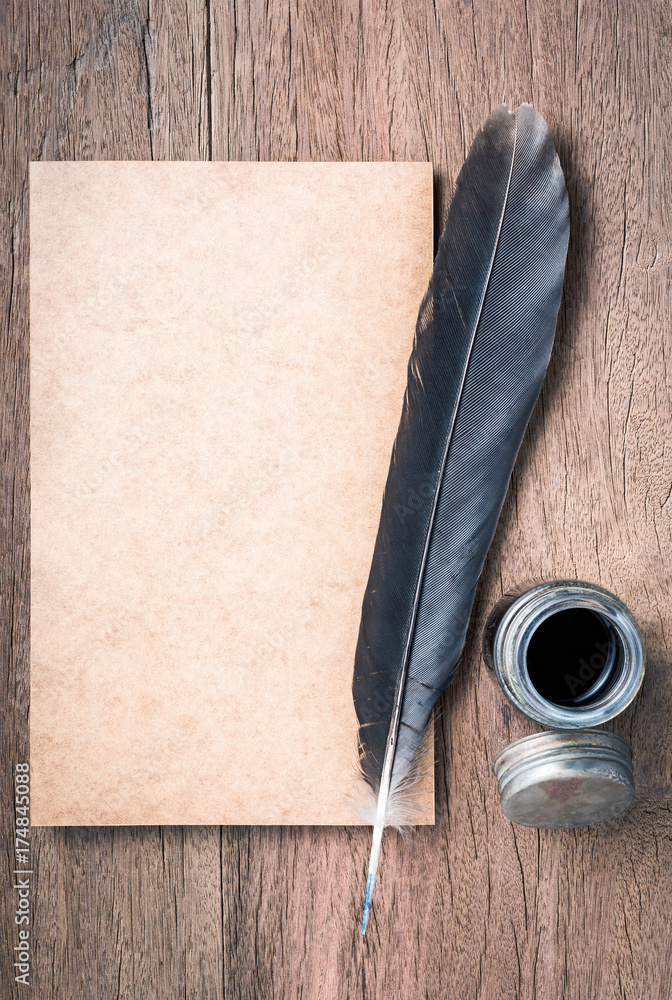 still life photography : top view of blank old paper with feather pen and  inkwell on old wooden table Stock Photo | Adobe Stock