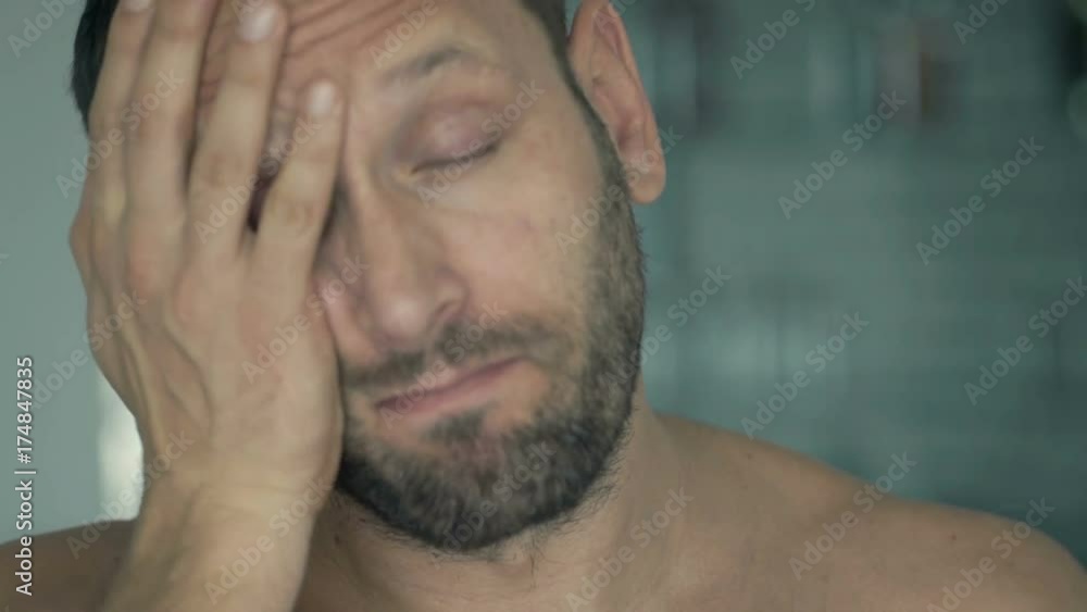Sleepy man drinking coffee at home
Sleepy man drinking coffee at home