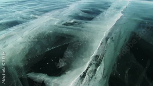 Baikal Ice Surface. Cracks in transparent ice.

