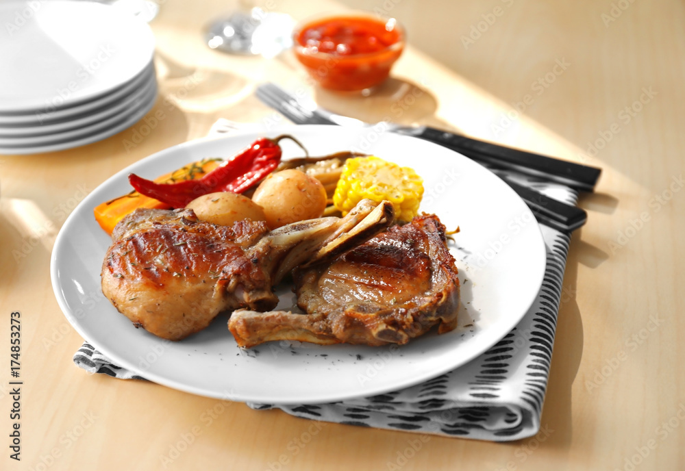 Plate with grilled meat on table Plate with grilled meat on table