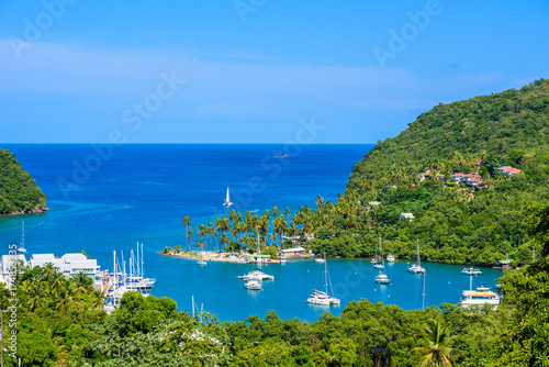Marigot Bay, Saint Lucia, Caribbean. Tropical bay and beach in exotic and paradise landscape scenery. Marigot Bay is located on the west coast of the Caribbean island of St Lucia. photo