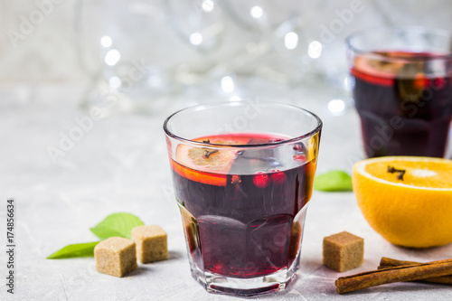 Christmas holiday drink, mulled wine, lights background. Top view, space for text. Selective focus, space for text.