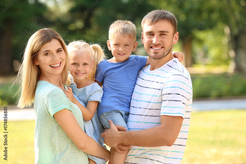 Happy family in park on sunny day Happy family in park on sunny day