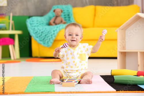 Cute little baby playing wi...