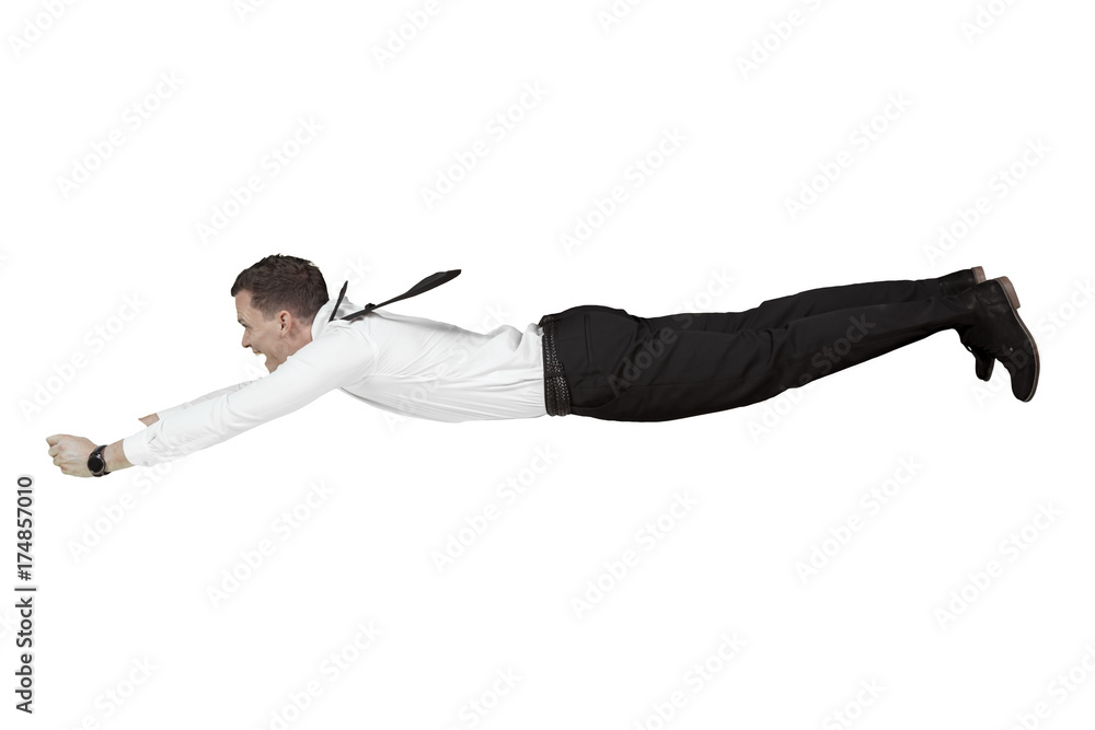 Happy businessman flying in studio Happy businessman flying in studio