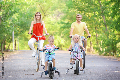 Happy family riding bicycle...