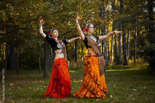 two girls dancing on the nature