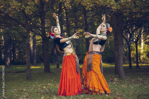 girls perform a dance in nature