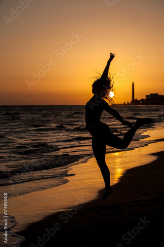 woman on beach sunset