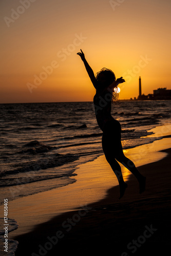 woman on beach sunset