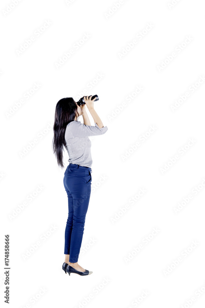 Businesswoman looking through a binocular Businesswoman looking through a binocular